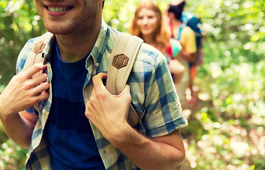 Image showing close up of friends with backpacks hiking