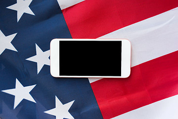 Image showing close up of smartphone on american flag