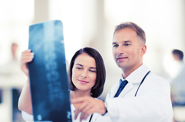 Image showing two doctors looking at x-ray