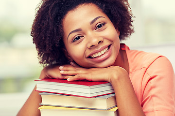 Image showing happy african student girl with books at home