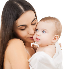 Image showing mother kissing adorable baby