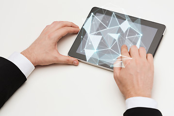 Image showing close up of hands with tablet pc and low poly form