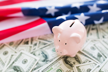 Image showing close up of american flag, piggy bank and money