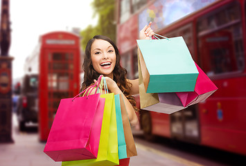 Image showing woman with shopping bags over london city street