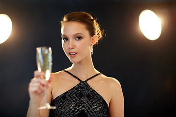 Image showing young asian woman drinking champagne at party