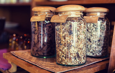 Image showing close up of jars with granola at grocery store