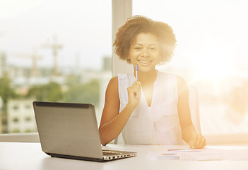 Image showing happy african woman with laptop at office