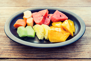 Image showing plate of fresh juicy fruits at asian restaurant