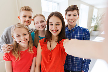 Image showing group of students taking selfie with smartphone