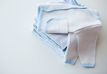 Image showing close up of baby boys clothes for newborn on table