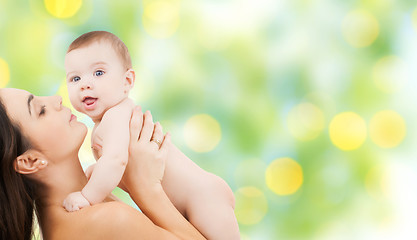 Image showing happy mother holding adorable baby