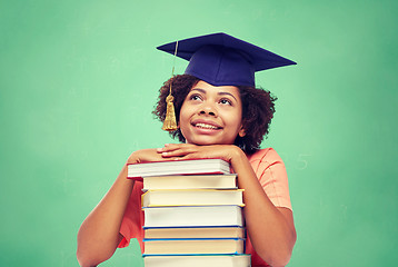 Image showing happy african bachelor girl with books at school