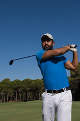 Image showing golf player hitting shot