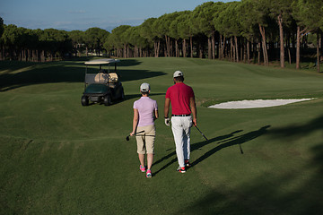 Image showing couple walking on golf course