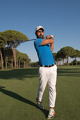 Image showing golf player hitting shot