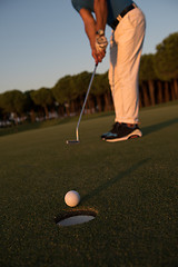 Image showing golfer  hitting shot at golf course