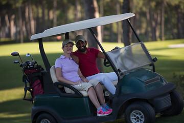 Image showing couple in buggy on golf course