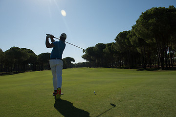 Image showing golf player hitting shot