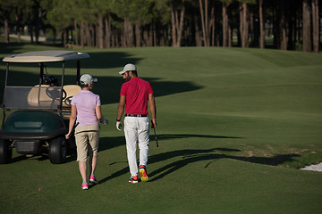 Image showing couple walking on golf course