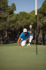 Image showing golf player aiming perfect  shot