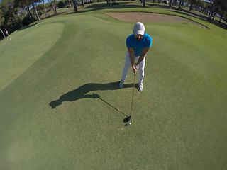 Image showing top view of golf player hitting shot