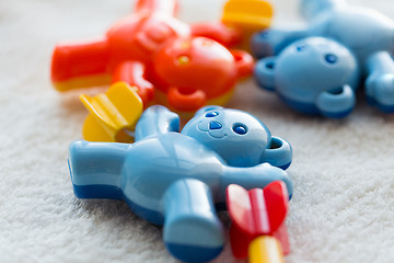 Image showing close up of baby rattle on towel