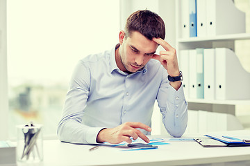 Image showing close up of businessman with smartphone