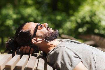 Image showing happy man with earphones listening to music