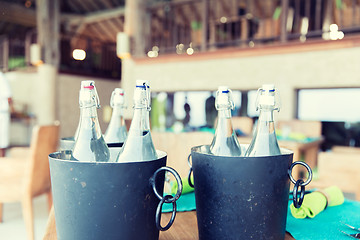 Image showing bottles of water in ice bucket at hotel restaurant