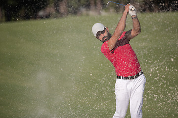 Image showing golfer hitting a sand bunker shot