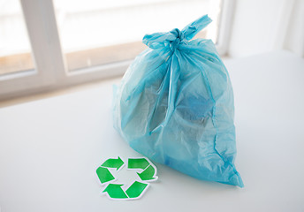 Image showing close up of rubbish bag with green recycle symbol