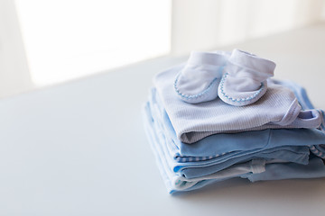 Image showing close up of baby boys clothes for newborn on table