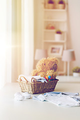 Image showing close up of baby clothes and toys for newborn