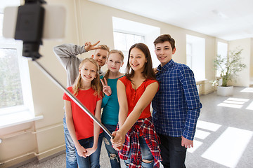 Image showing group of students taking selfie with smartphone