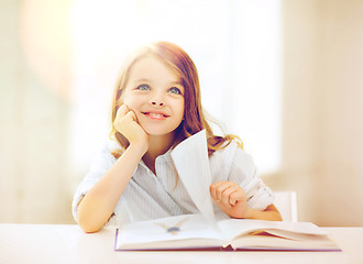 Image showing little student girl studying at school