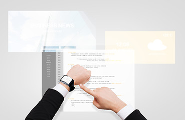 Image showing businessman hands with coding on smart watch