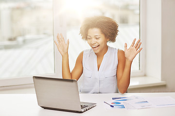 Image showing happy african woman with laptop at office