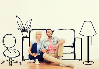 Image showing happy couple of man and woman moving to new home