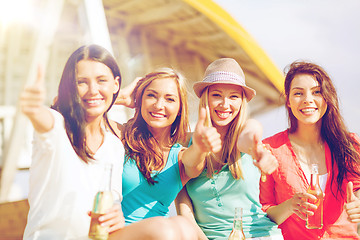 Image showing girls with drinks on the beach