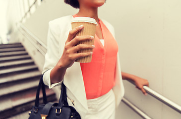 Image showing close up of african businesswoman with coffee