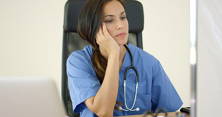 Image showing Serious female doctor at laptop computer