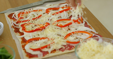 Image showing Woman make a tasty traditional homemade pizza