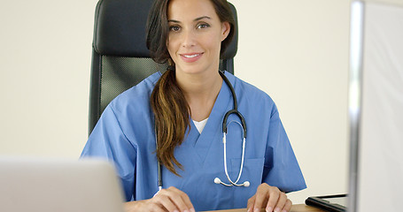 Image showing Beautiful female doctor at laptop computer