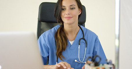 Image showing Beautiful female doctor at laptop computer