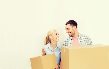 Image showing couple with delivery boxes moving to new home