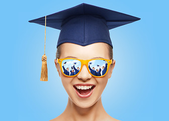 Image showing happy teenage girl in shades and mortarboard hat