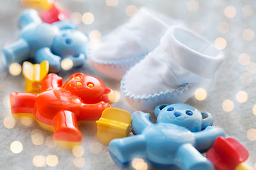 Image showing close up of baby rattle and bootees for newborn