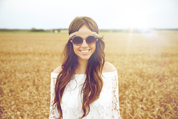 Image showing smiling young hippie woman on cereal field