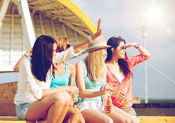 Image showing girls with drinks on the beach