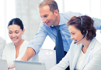 Image showing group of people working in call center